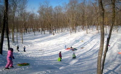 Sledding hill fun in the "back bowl" at Maplelag.