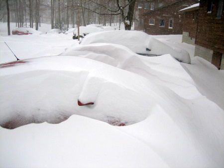 Buried in snow around the cabins at Maplelag after late April snow storm dumped nearly 2 feet of snow.