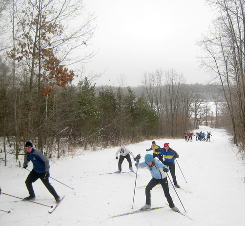 Wayzata Nordic ski team members coming up Suicide Hill.