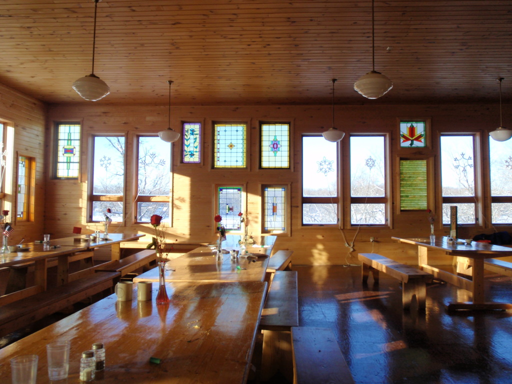 Photo taken by Ellen Smith in the dining room of the stained glass windows lighting up nicely with the afternoon sun.