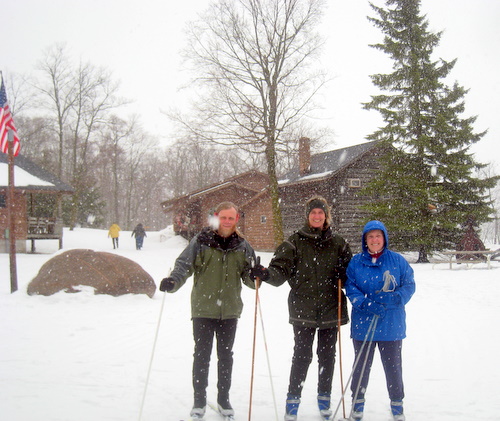 feb10-011 Lee and Lindsay Lee along with Margaret Kuchenreuther getting ready to head out for a afternoon ski while fresh snow was falling Tuesday afternoon.