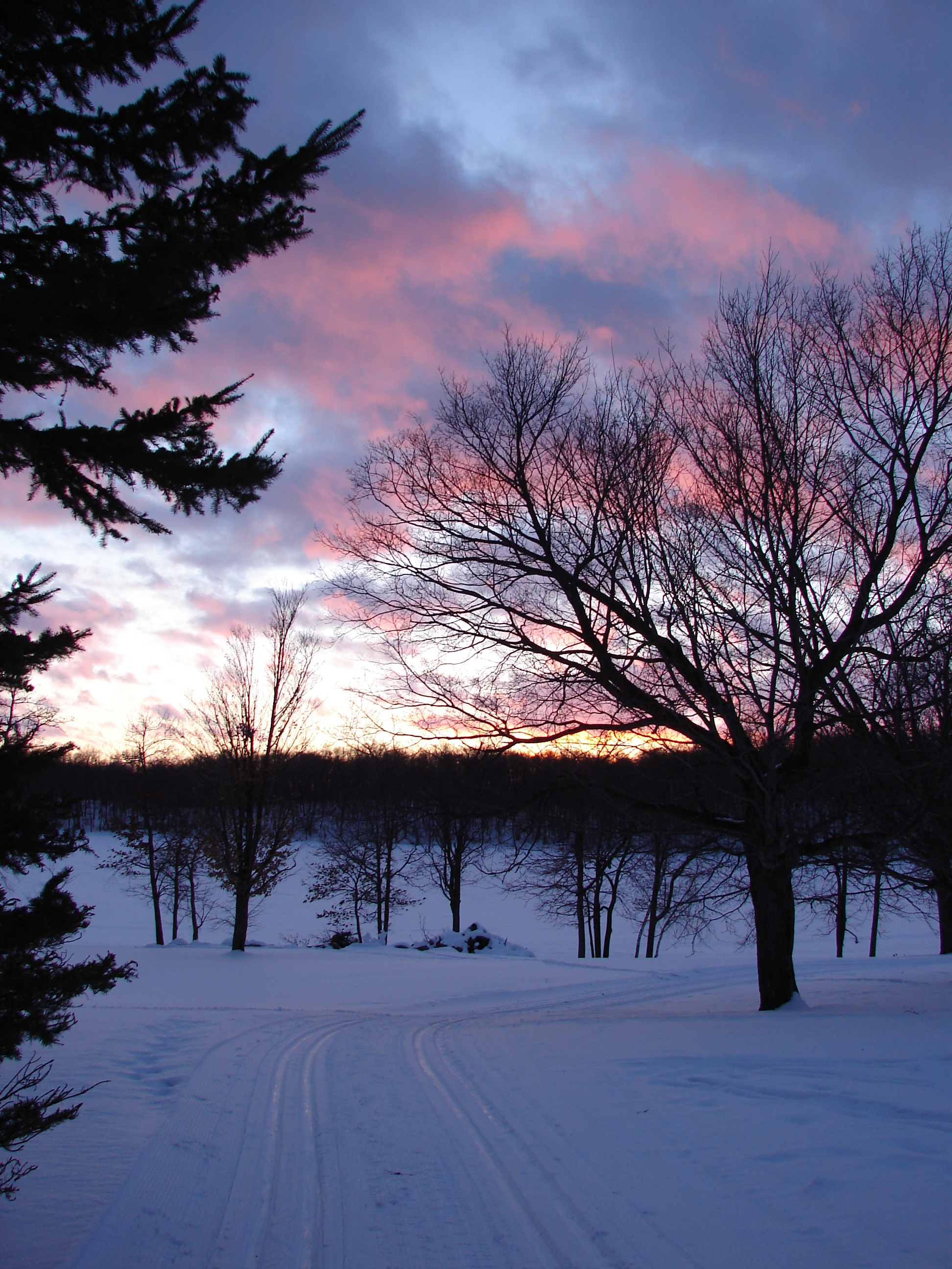 Photo taken by Jean Kraft of sunset over Little Sugarbush and Loon Return ski trail.