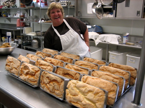 Head cook Deb Olk with fresh loaves right out of the oven. 