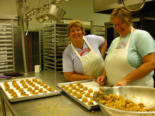 Deb and Carlene scooping up a batch of "monster cookies". A fifth cookie added to the bottomless cookie jars  that has gone over well this Fall. Maplelag cranks out over 100,000 cookies in a year for the bottomless cookie jars, included, as always as part of the "package".