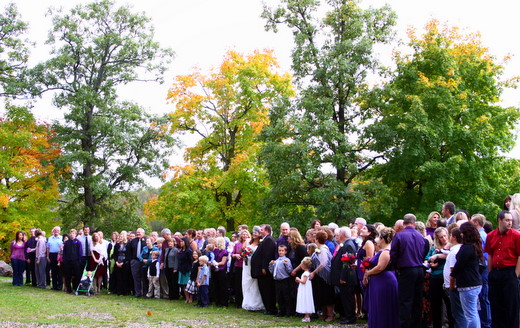 Friends and family surround this weekends newlyweds, Lacy and Donny, in front of the lodge. 