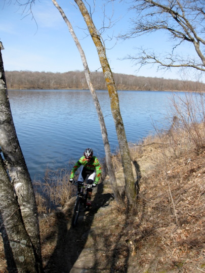 Riding on the mountain bike course lakeside on a beatiful Sunday morning.