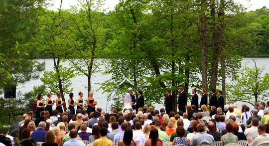 Wedding ceremony on the shores of Little Sugarbush for Natalie and Dustin.