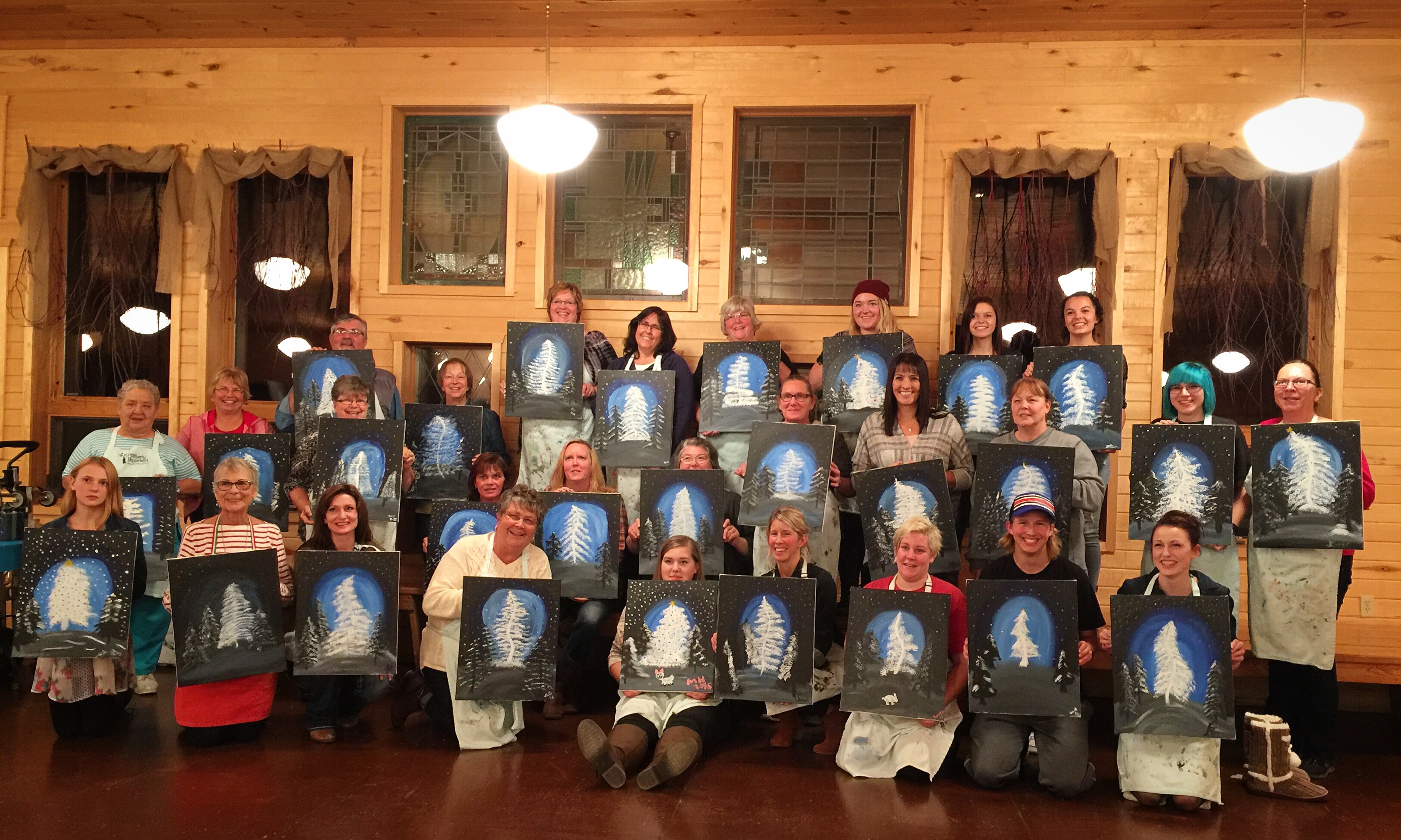 Maplelag team members with finished paintings after an evening with "Creatively Uncorked" for last nights staff party. November 10th, 2015.